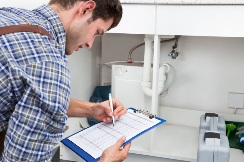 plumber with clipboard